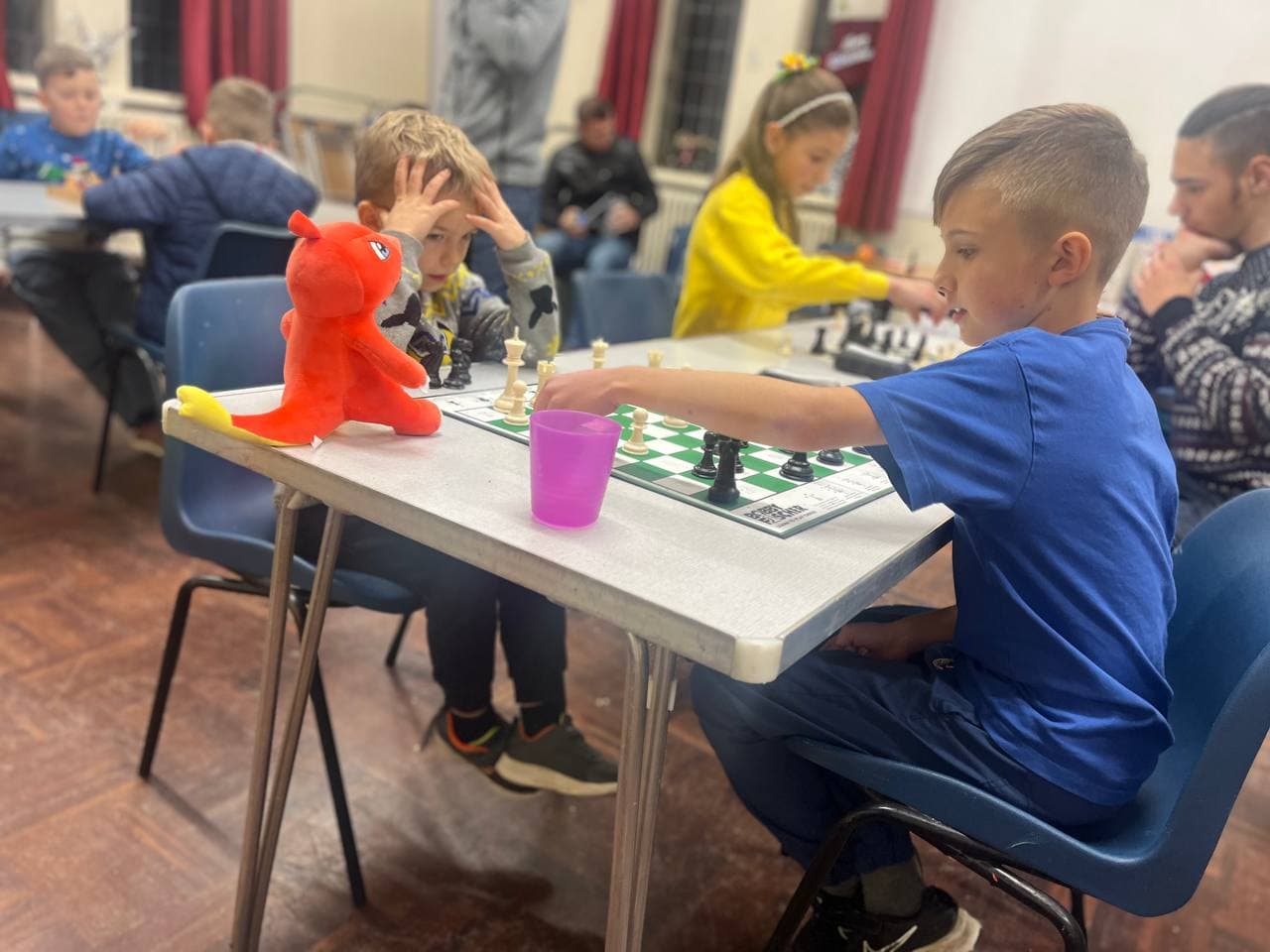 Children playing chess during a Chess4U session in Glasgow